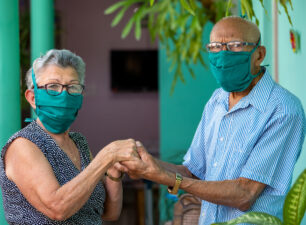 An elderly couple with face mask